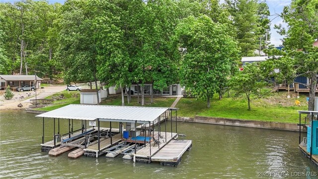 47 Dixie Ln, Sunrise Beach, MO 65079 - dock area with a water view, boat lift, and a lawn