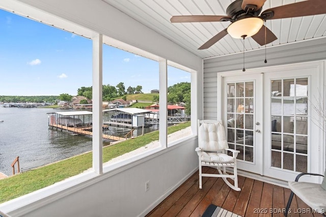 29566 Hunter Rd, Gravois Mills, MO 65037 - sunroom featuring a water view, hardwood / wood-style floors, healthy amount of natural light, and baseboards