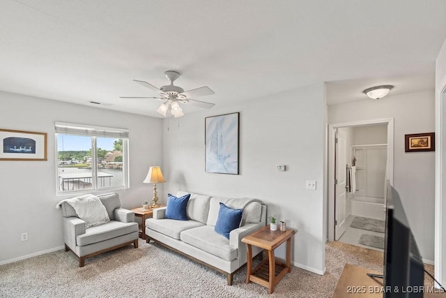 29566 Hunter Rd, Gravois Mills, MO 65037 - living room featuring ceiling fan, baseboards, and light carpet
