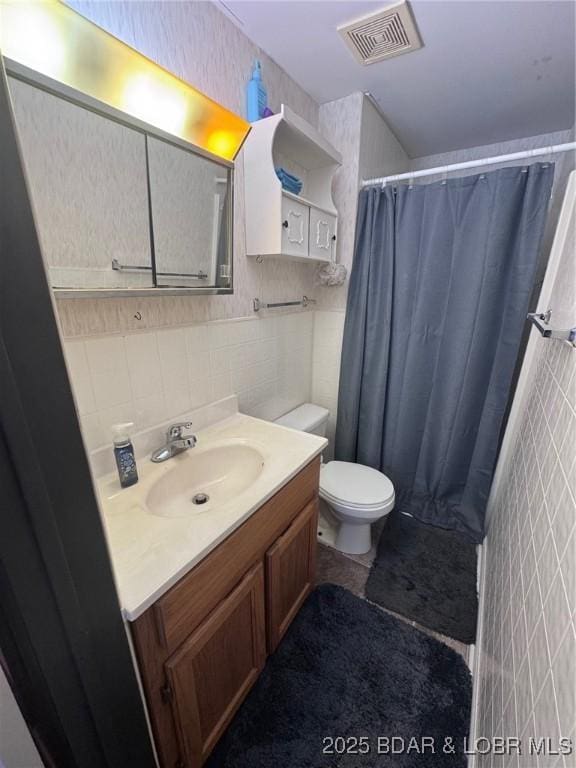 35 Knotty Pine Ln, Camdenton, MO 65020 - bathroom featuring tile walls, vanity, toilet, and a shower with curtain