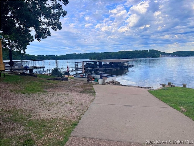 35 Knotty Pine Ln, Camdenton, MO 65020 - dock featuring a boat ramp and a water view