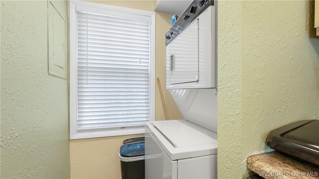 86 Henrys Way Unit 2A, Linn Creek, MO 65052 - laundry area featuring stacked washer / dryer and a textured wall