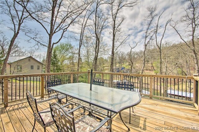 31806 Lakeview Ln, Gravois Mills, MO 65037 - wooden deck with outdoor dining space