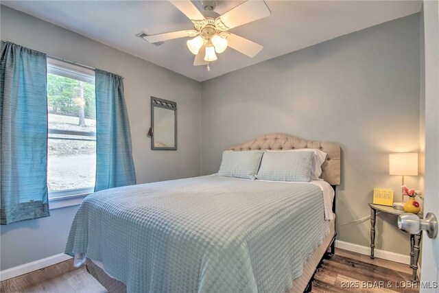 31806 Lakeview Ln, Gravois Mills, MO 65037 - bedroom featuring wood finished floors, baseboards, and ceiling fan