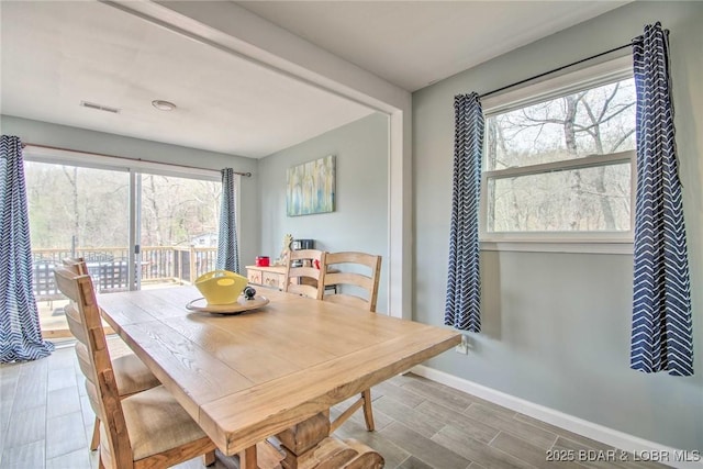 31806 Lakeview Ln, Gravois Mills, MO 65037 - dining space with healthy amount of natural light, baseboards, and wood finished floors