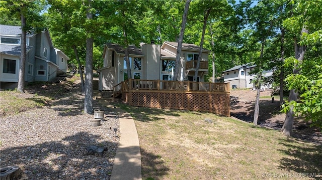 62 Durham Ct, Four Seasons, MO 65049 - view of yard featuring a wooden deck