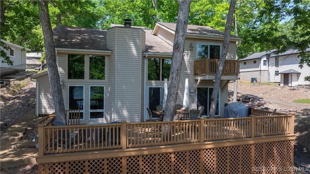 62 Durham Ct, Four Seasons, MO 65049 - rear view of property with a deck, a chimney, and a balcony