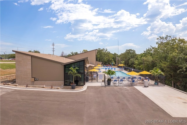 62 Durham Ct, Four Seasons, MO 65049 - view of property with a community pool