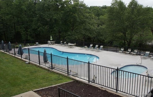 62 Durham Ct, Four Seasons, MO 65049 - community pool featuring a patio and a view of trees
