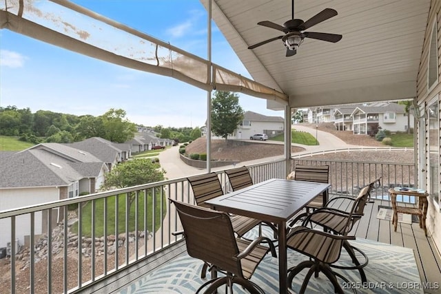 879 Great Ship St, Osage Beach, MO 65065 - wooden deck featuring a residential view, a ceiling fan, and outdoor dining space