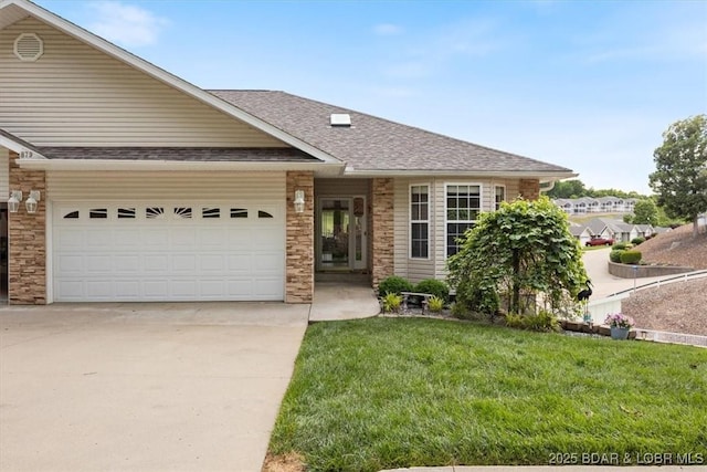 879 Great Ship St, Osage Beach, MO 65065 - view of front of home featuring driveway, an attached garage, a front yard, a shingled roof, and stone siding