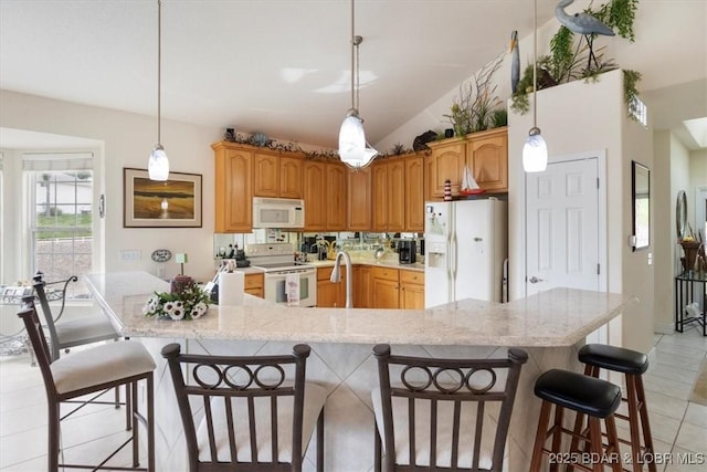 879 Great Ship St, Osage Beach, MO 65065 - kitchen featuring white appliances, a kitchen bar, light tile patterned floors, vaulted ceiling, and a sink