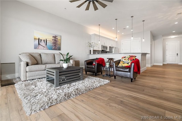 166 Captiva Dr Unit 8B, Sunrise Beach, MO 65079 - living area with ceiling fan, light wood-type flooring, baseboards, and recessed lighting