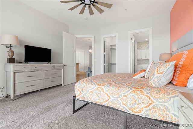166 Captiva Dr Unit 8B, Sunrise Beach, MO 65079 - bedroom with a walk in closet, ensuite bathroom, light carpet, a closet, and ceiling fan