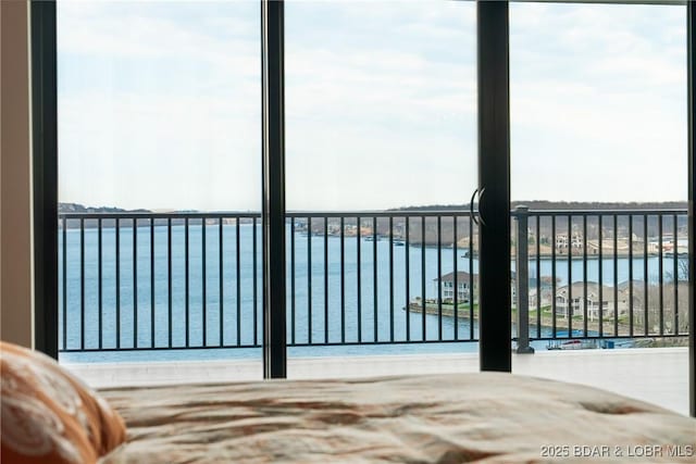166 Captiva Dr Unit 8B, Sunrise Beach, MO 65079 - unfurnished bedroom with a water view