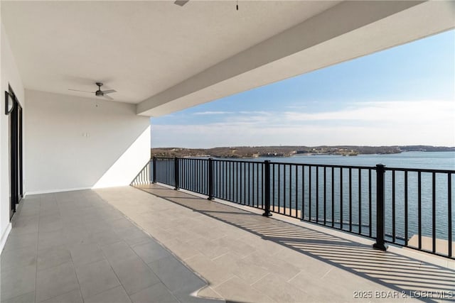 166 Captiva Dr Unit 8B, Sunrise Beach, MO 65079 - balcony with ceiling fan and a water view