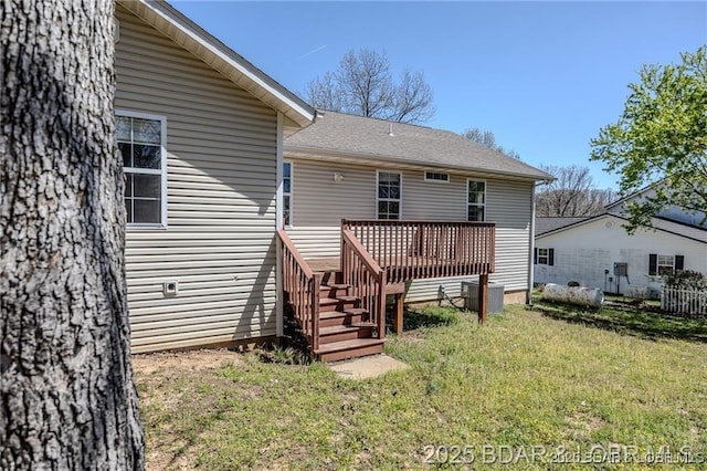 20715 Hiltner Ln, Saint Robert, MO 65584 - back of house with a wooden deck and a lawn