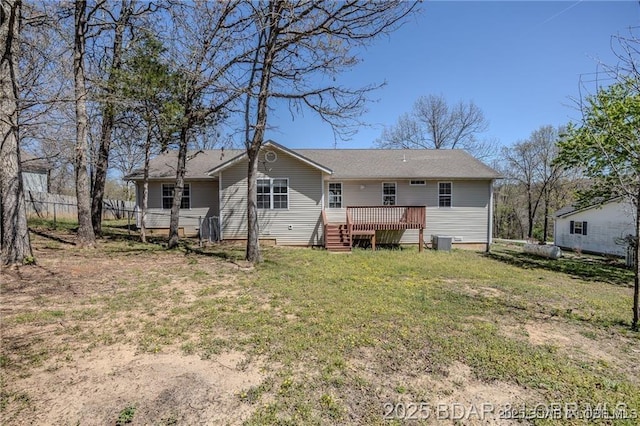 20715 Hiltner Ln, Saint Robert, MO 65584 - back of property featuring a wooden deck, a lawn, and central AC unit