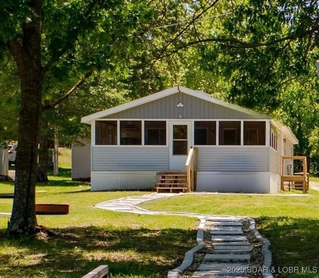 30734 Ottersway Rd, Gravois Mills, MO 65037 - view of front of home featuring a front yard and a sunroom