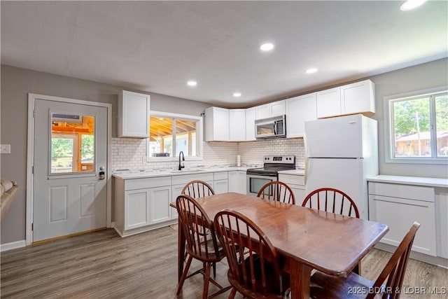 30734 Ottersway Rd, Gravois Mills, MO 65037 - dining area with plenty of natural light, wood finished floors, and recessed lighting