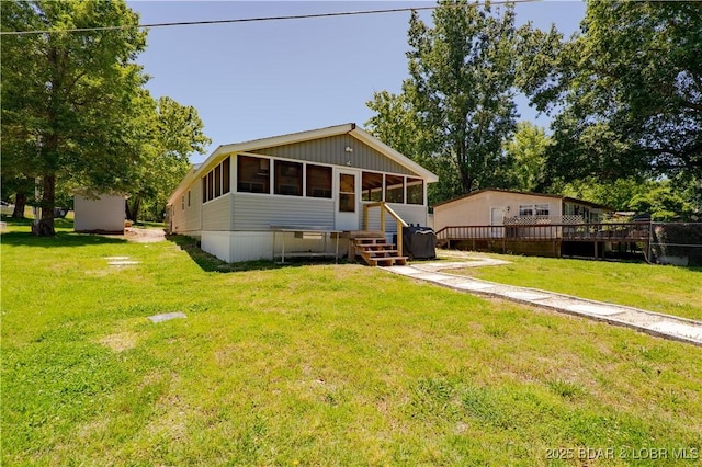 30734 Ottersway Rd, Gravois Mills, MO 65037 - manufactured / mobile home with a sunroom and a front yard