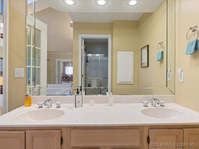 335 Charleston Dr Unit 3B, Lake Ozark, MO 65049 - ensuite bathroom featuring double vanity and a shower with door