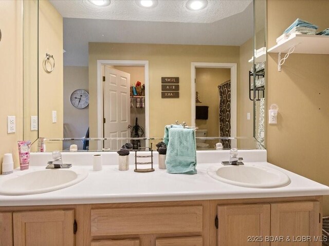 335 Charleston Dr Unit 3B, Lake Ozark, MO 65049 - bathroom with double vanity and recessed lighting
