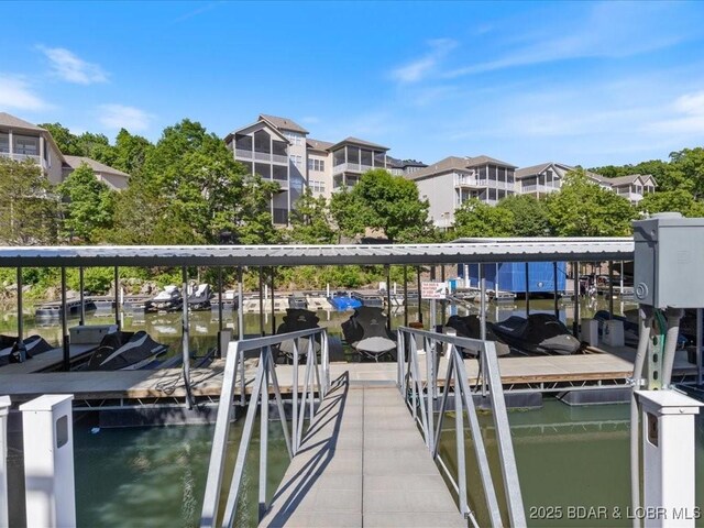 335 Charleston Dr Unit 3B, Lake Ozark, MO 65049 - dock area featuring a water view and boat lift