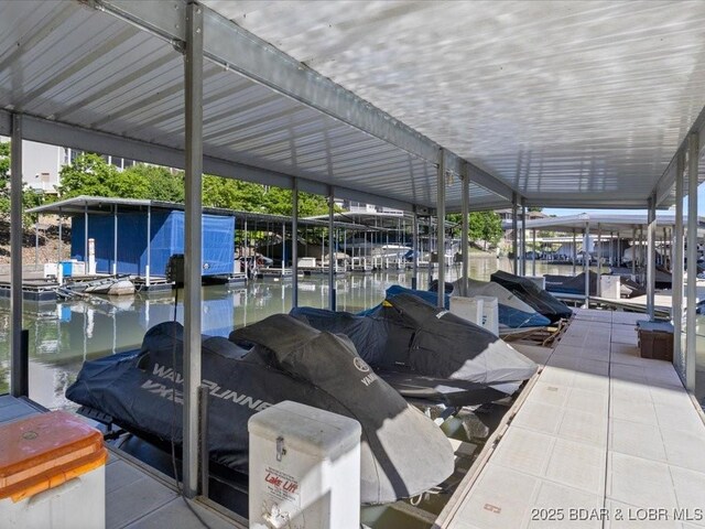 335 Charleston Dr Unit 3B, Lake Ozark, MO 65049 - dock area with boat lift and a water view