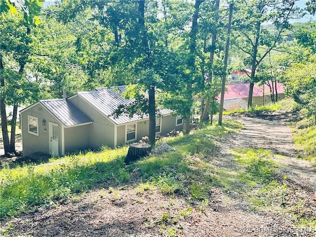 33722 Waterfront Dr, Stover, MO 64078 - view of property exterior featuring a standing seam roof and metal roof