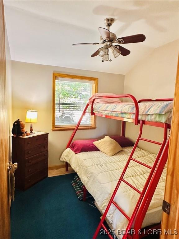 33722 Waterfront Dr, Stover, MO 64078 - bedroom with lofted ceiling, ceiling fan, baseboards, and carpet