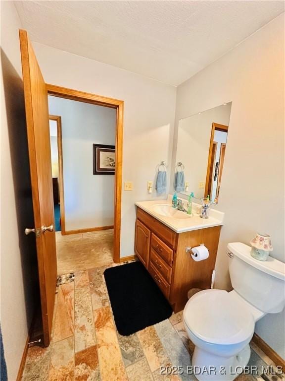 33722 Waterfront Dr, Stover, MO 64078 - bathroom with vanity, toilet, and baseboards