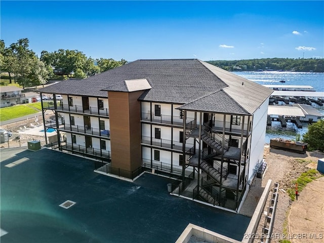 4935 Robins Cir Unit 2C, Osage Beach, MO 65065 - back of property with roof with shingles and a water view