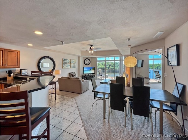 4800 Eagleview Dr Unit 6104, Osage Beach, MO 65065 - dining room featuring a ceiling fan, light tile patterned flooring, a textured ceiling, and recessed lighting