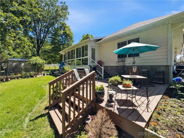 204 Wellington Ln, Laurie, MO 65037 - wooden deck featuring a lawn and a sunroom
