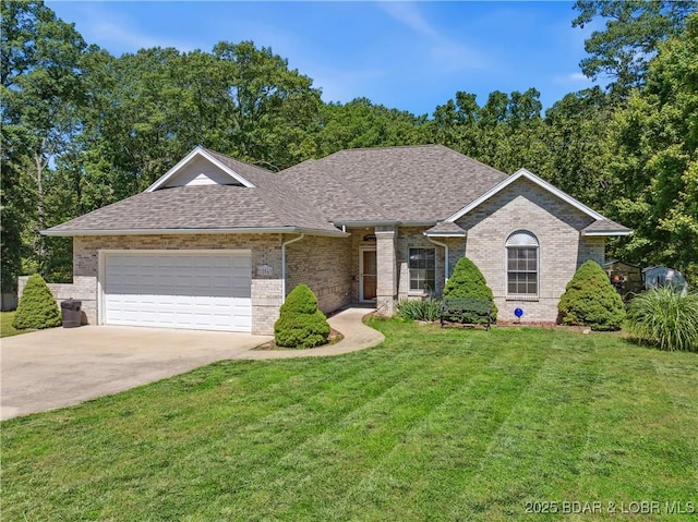 204 Wellington Ln, Laurie, MO 65037 - view of front of house with a shingled roof, brick siding, an attached garage, and a front yard