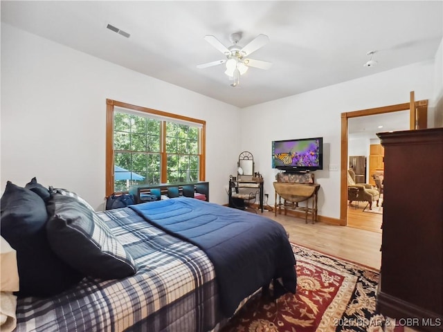 204 Wellington Ln, Laurie, MO 65037 - bedroom featuring wood finished floors and ceiling fan