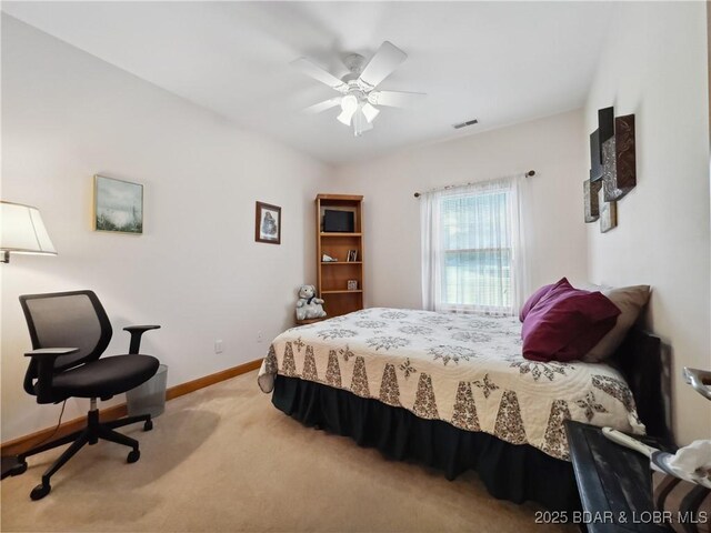 204 Wellington Ln, Laurie, MO 65037 - bedroom featuring light carpet, baseboards, and a ceiling fan