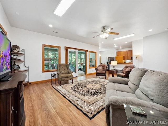 204 Wellington Ln, Laurie, MO 65037 - living room with light wood finished floors, a ceiling fan, recessed lighting, and baseboards