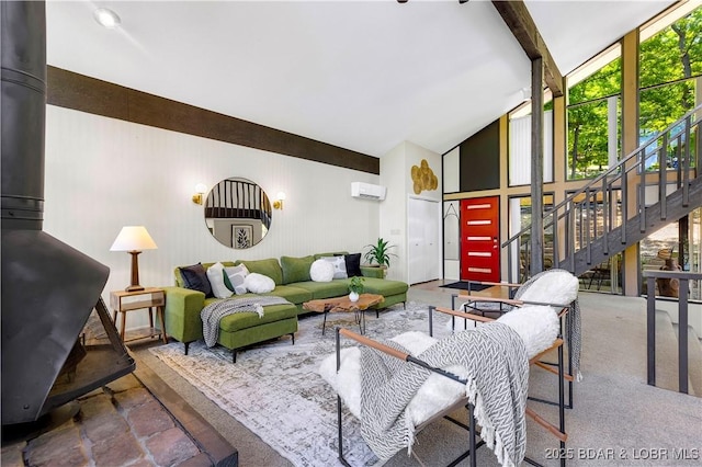491 Walkers Cay, Osage Beach, MO 65065 - living area featuring healthy amount of natural light, stairway, high vaulted ceiling, beam ceiling, and a wood stove