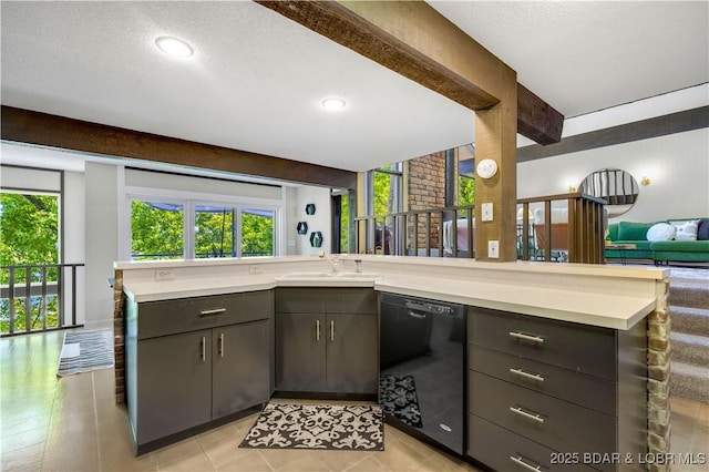 491 Walkers Cay, Osage Beach, MO 65065 - kitchen with dishwasher, a peninsula, a sink, light countertops, and a textured ceiling