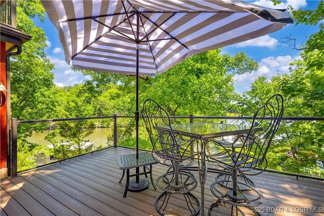 491 Walkers Cay, Osage Beach, MO 65065 - deck with outdoor dining area and view of wooded area
