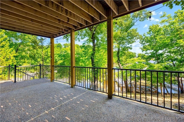 491 Walkers Cay, Osage Beach, MO 65065 - view of patio with a balcony and view of wooded area