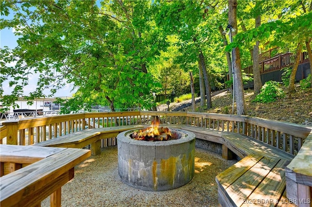 491 Walkers Cay, Osage Beach, MO 65065 - wooden deck with a fire pit