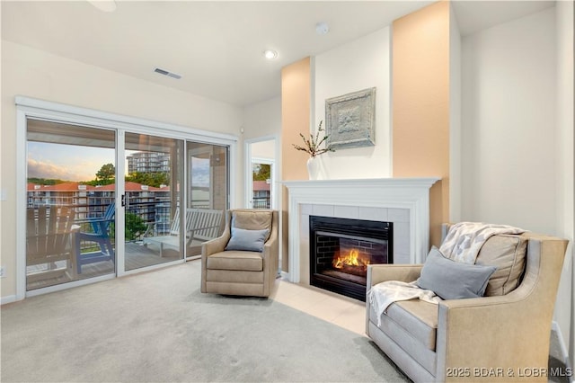 184 E Palisades Condo Dr Unit 4A, Lake Ozark, MO 65049 - living area with carpet, a tiled fireplace, and recessed lighting