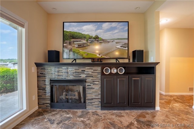 55 Shagbark Dr, Sunrise Beach, MO 65079 - unfurnished living room with a fireplace and baseboards