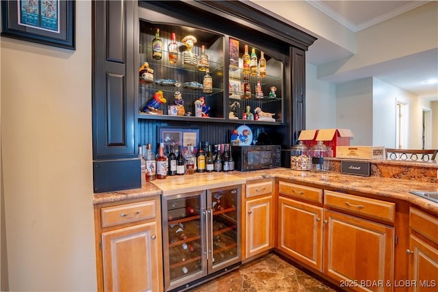 55 Shagbark Dr, Sunrise Beach, MO 65079 - indoor dry bar with wine cooler, ornamental molding, and black microwave