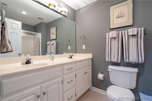 55 Shagbark Dr, Sunrise Beach, MO 65079 - full bathroom featuring toilet, an enclosed shower, double vanity, tile patterned flooring, and baseboards