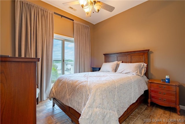 55 Shagbark Dr, Sunrise Beach, MO 65079 - bedroom with access to exterior, wood finished floors, and a ceiling fan