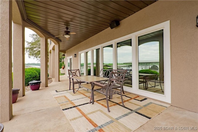 55 Shagbark Dr, Sunrise Beach, MO 65079 - view of patio / terrace featuring a ceiling fan and outdoor dining space